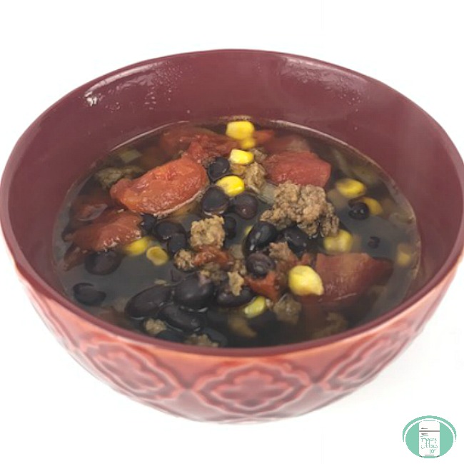 close up of beef taco soup with black beans and corn