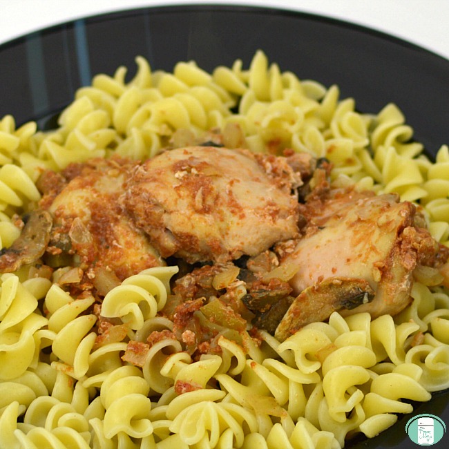 close up of chicken cacciatore on pasta