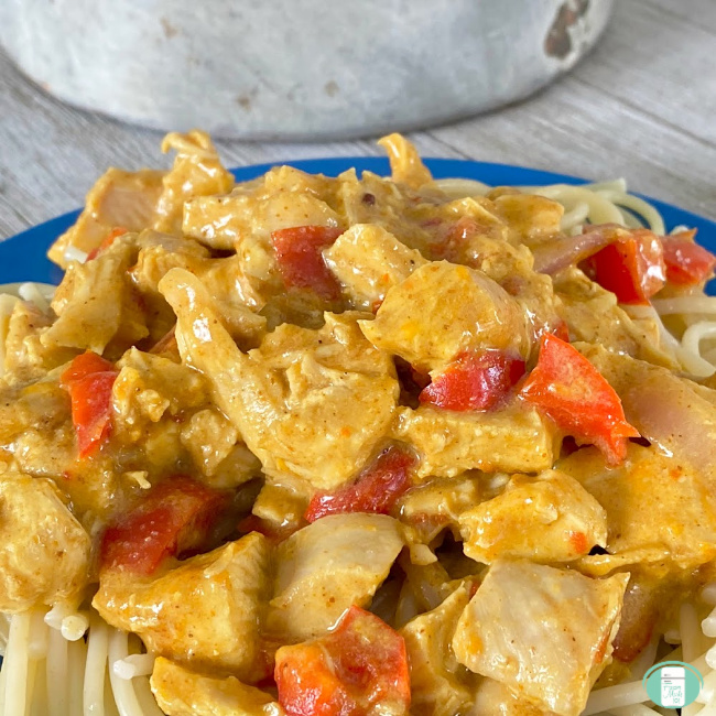chunks of chicken and red peppers and sauce