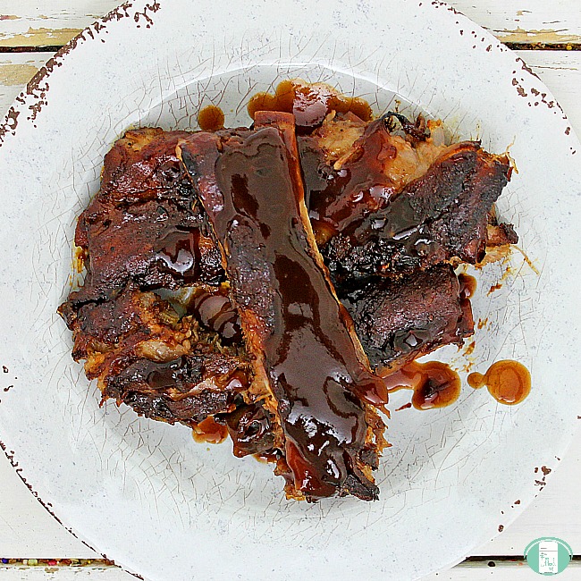 plate with country-style ribs that have lots of sauce on them