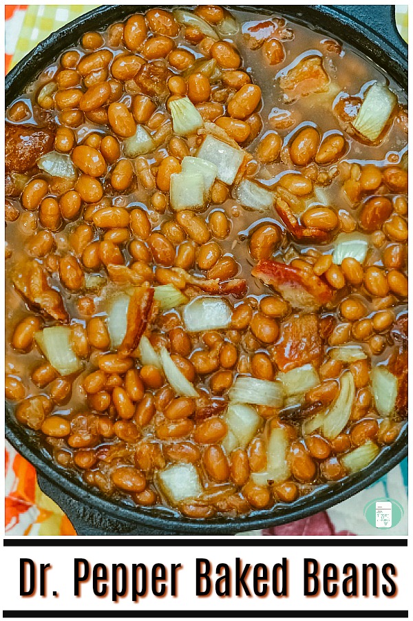 cast iron skillet with beans, onions, bacon, sauce and text that reads "Dr. Pepper Baked Beans" #freezermeals101 #bakedbeans #drpepper #drpepperbakedbeans