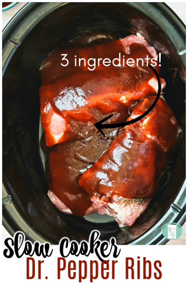 close up of a black slow cooker filled with ribs and red sauce with text that reads "3 ingredients Slow Cooker Dr. Pepper Ribs" #freeermeals101 #makeahead #slowcooker #drpepperribs 