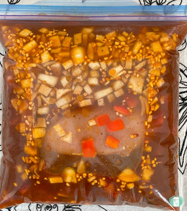 close up of freezer bag filled with enchilada soup ingredients