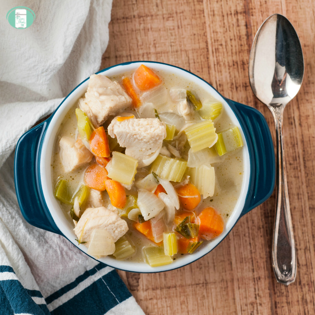 close up of chunky cream of chicken soup with celery and carrots