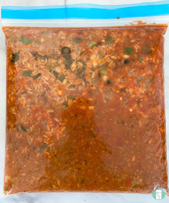 freezer bag with ingredients for Spanish rice casserole inside