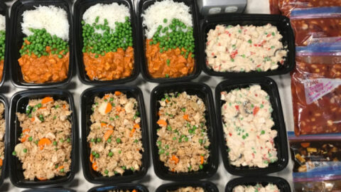 individual dinners in black containers