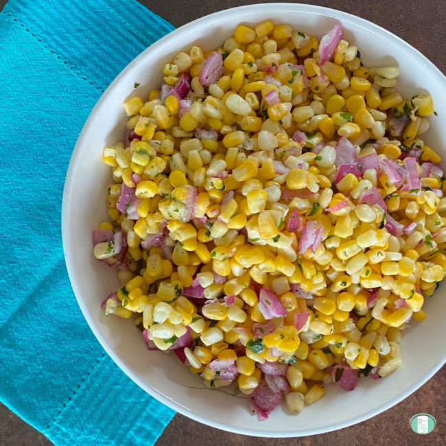 white bowl filled with corn, purple onions