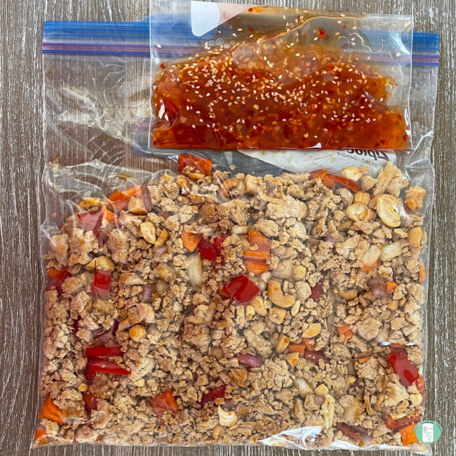clear bag with ground chicken and diced vegetables