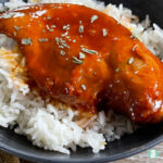 chicken in red sauce on white rice