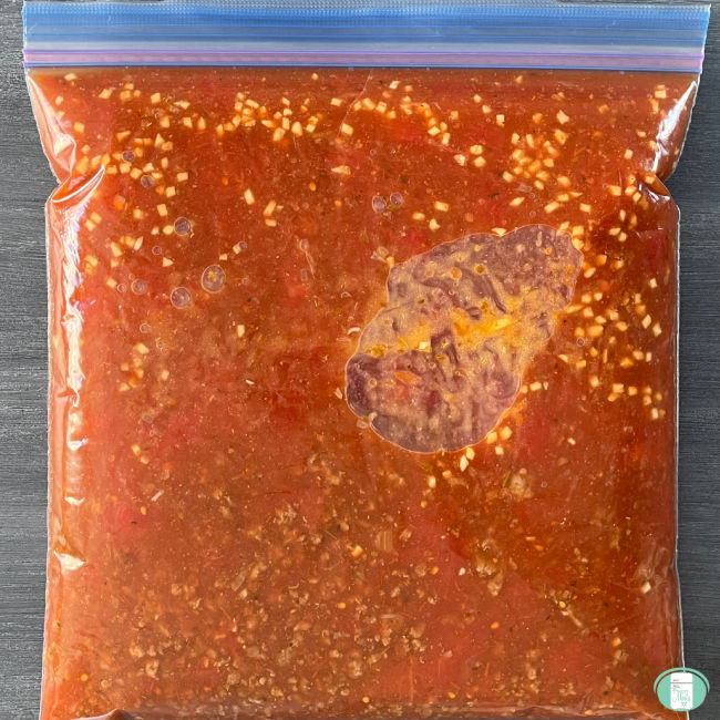 clear bag with red sauce in it