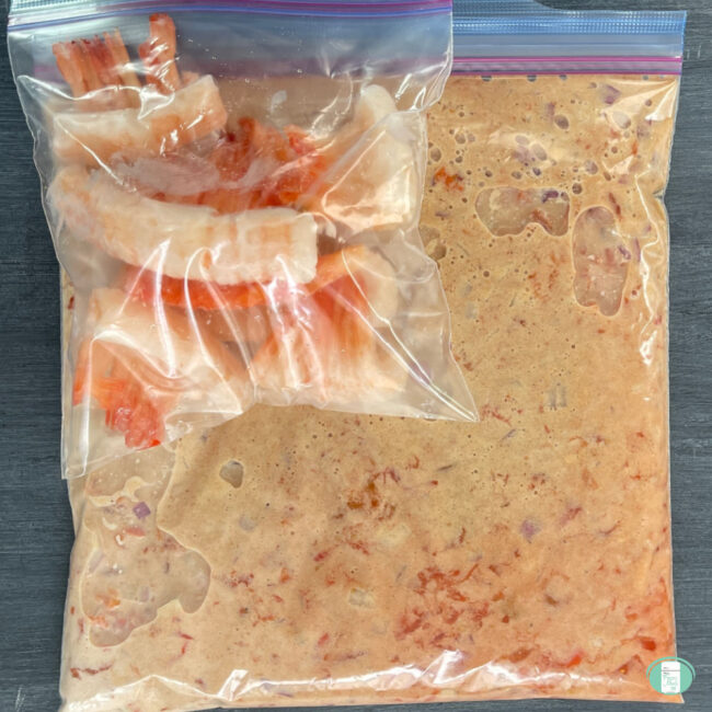 clear bag with sauce and shrimp