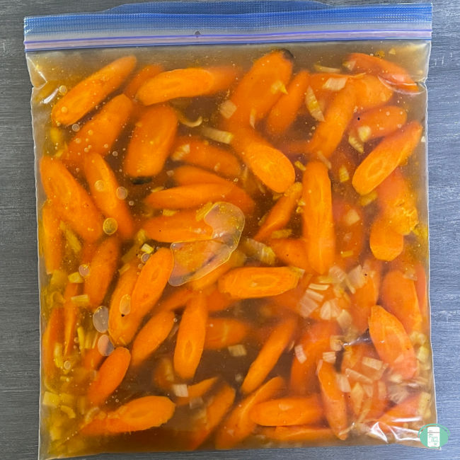 clear bag with carrot pieces and liquid