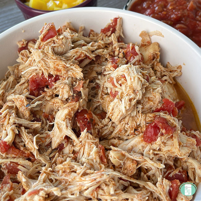 bowl with shredded chicken meat