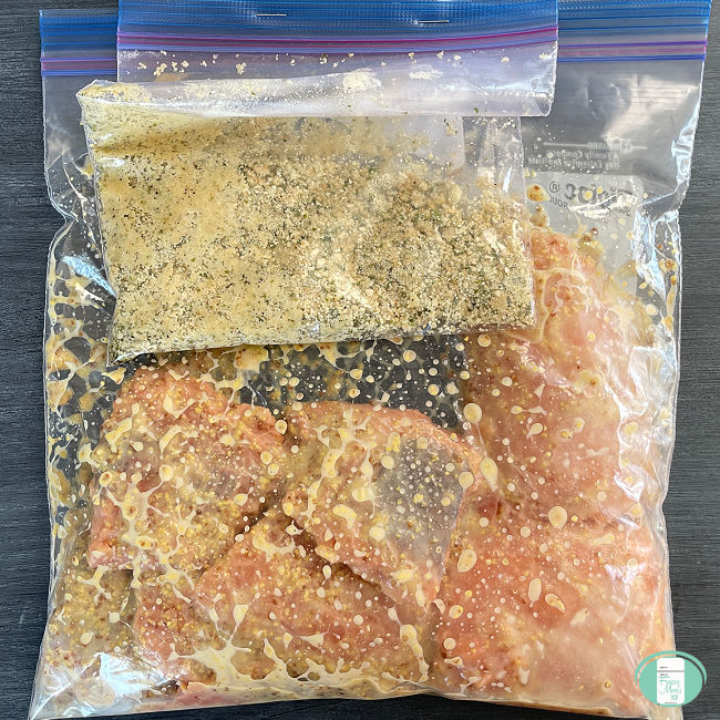 clear bag with salmon filets and a smaller clear bag with breadcrumbs