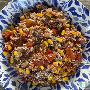 bowl of rice, ground beef, tomatoes, and corn