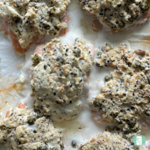 salmon topped with a white speckled crust