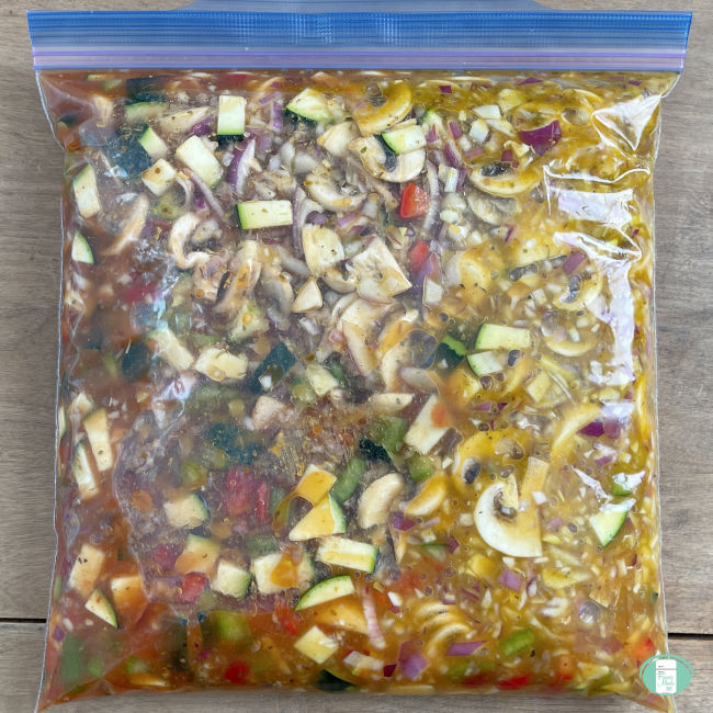 clear bag filled with chunky vegetables in sauce
