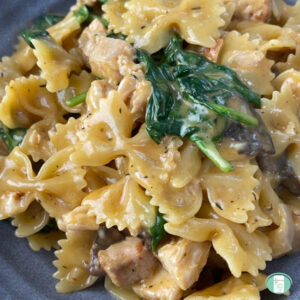 bowtie pasta, cubed chicken, mushrooms, and spinach