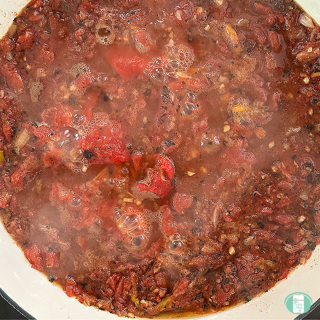 red sauce simmering in a skillet