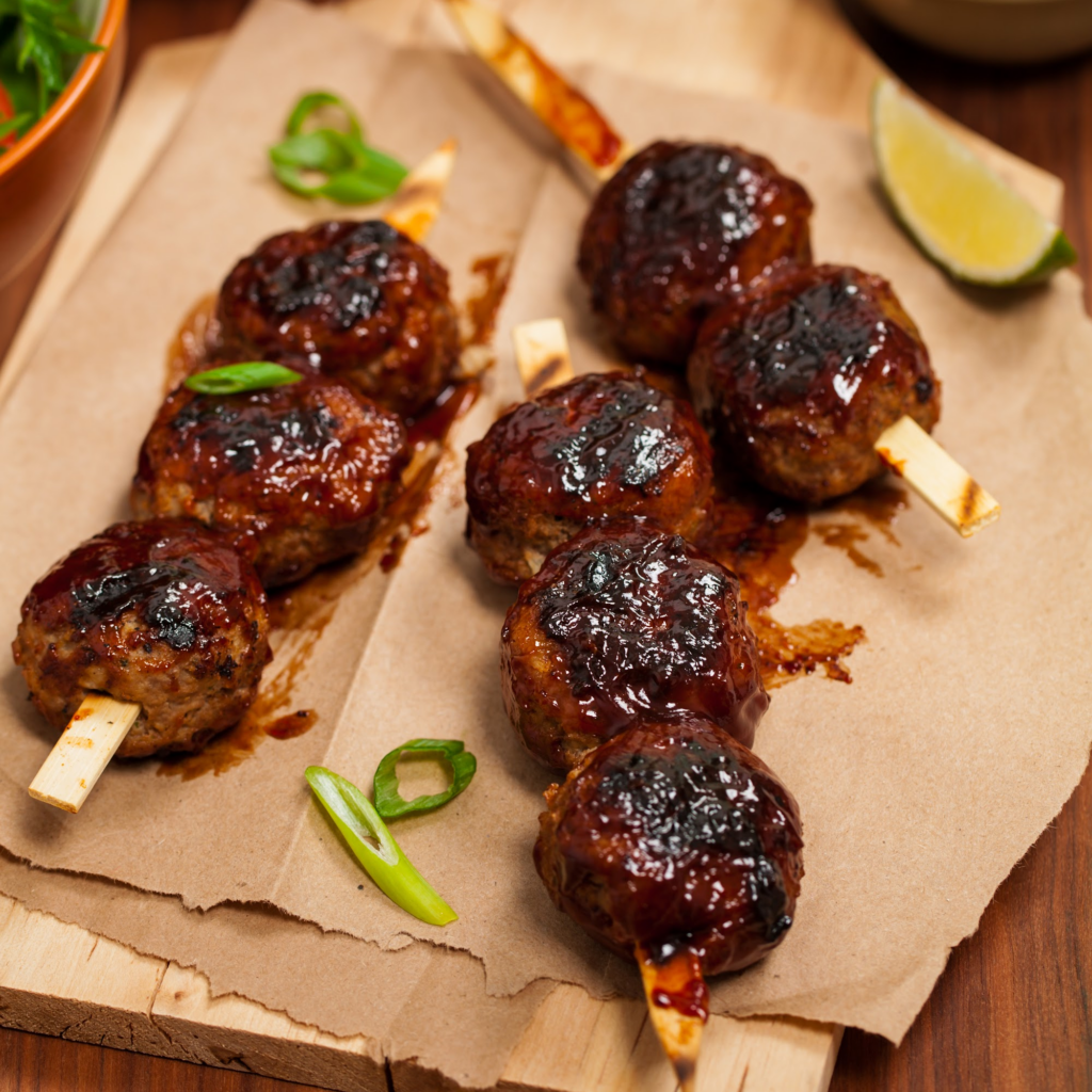 Skwered BBQ Beer Meatballs served on napkins 