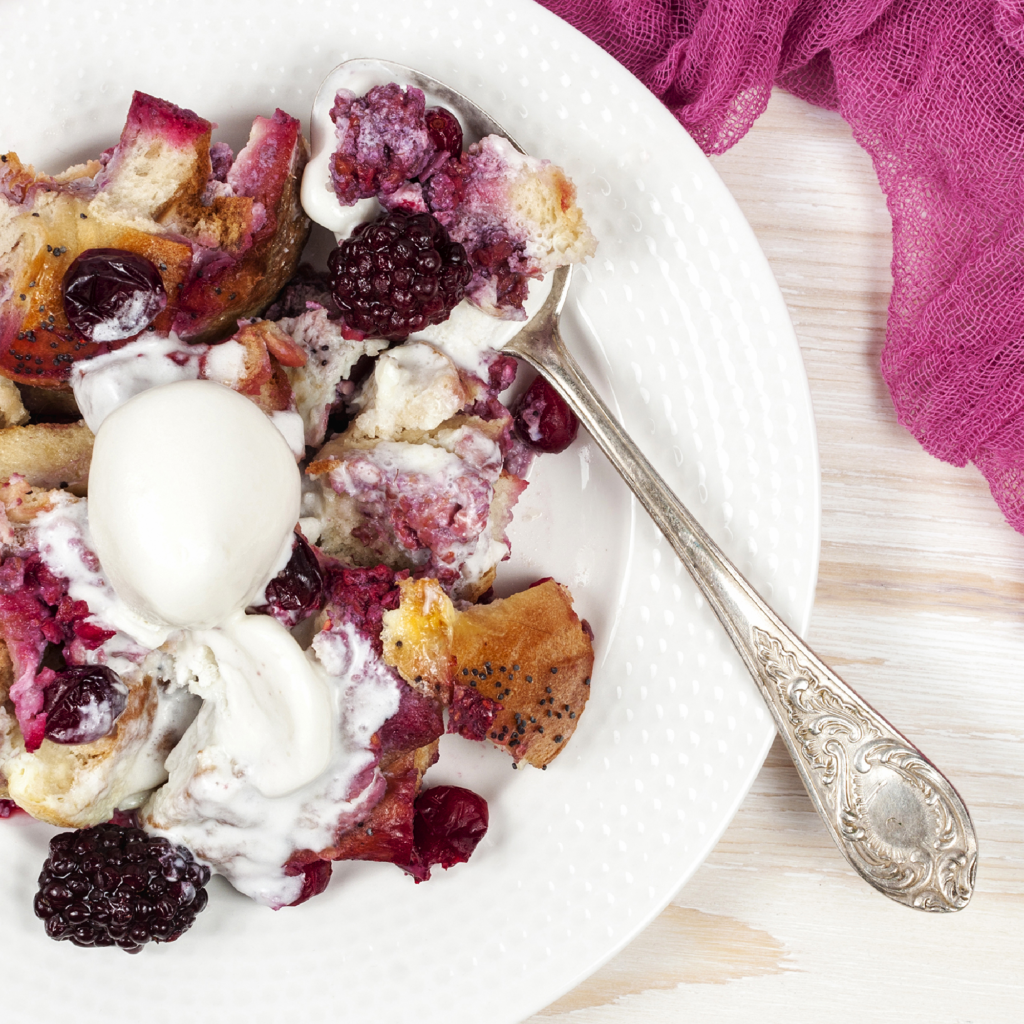 French Toast Casserole served with berries and whipped cream
