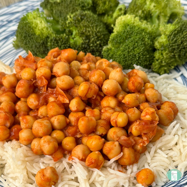 Buffalo Chickpeas close up over rice with broccoli.