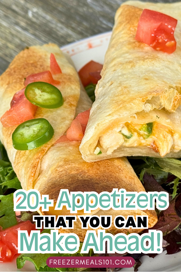 two taquitos filled with chicken and cheese and vegetables on a plate topped with sliced jalapenos and sliced tomatoes