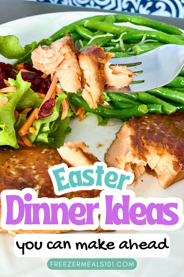 a bite of salmon on a fork with salmon, green beans, and salad on a plate in the background