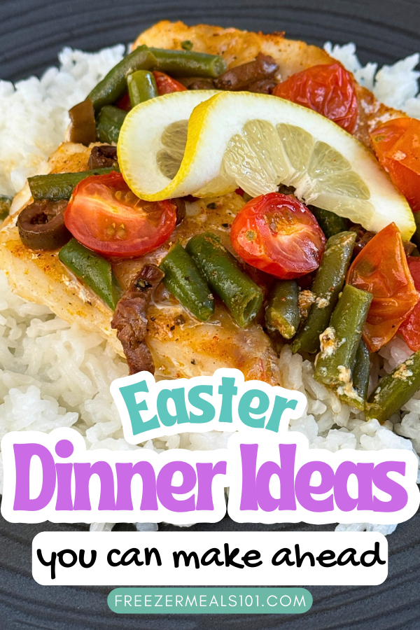 cod on rice topped with green beans, cherry tomatoes, and a lemon slice