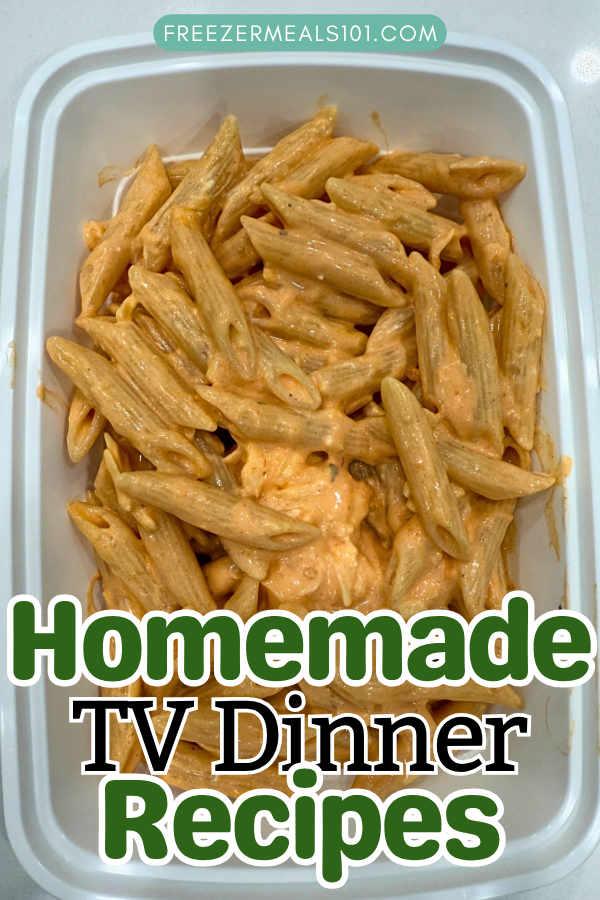 penne pasta in an orange sauce with small pieces of chicken