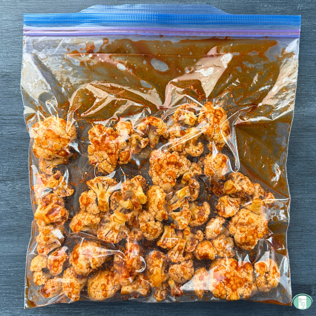 Cauliflower with sauce in freezer bag.