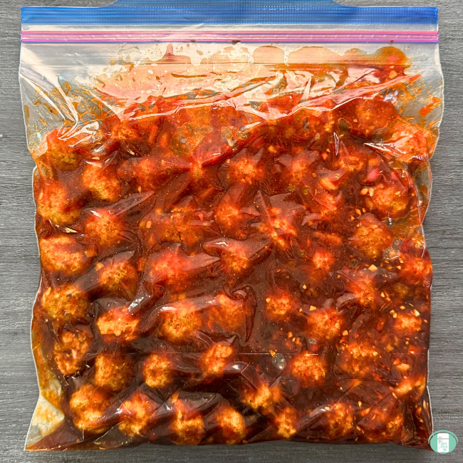 Meatballs with sauce in freezer bag.