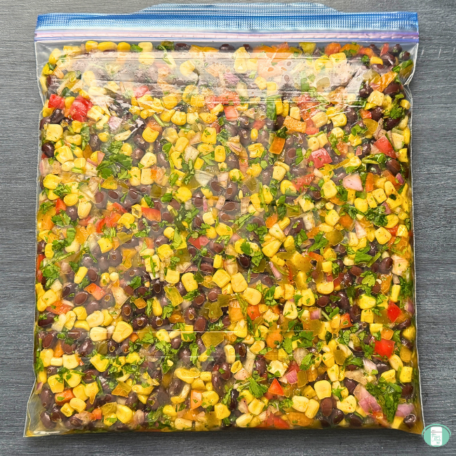 Cowboy Caviar - corn, beans red bell peppers in freezer bag.