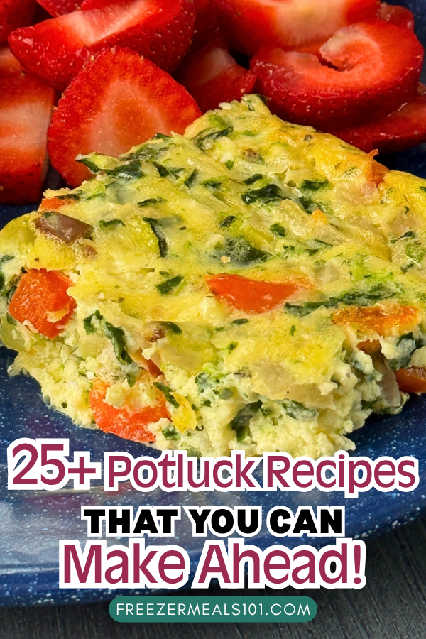 egg bake with red pepper, black olives, and spinach on a plate next to sliced strawberries