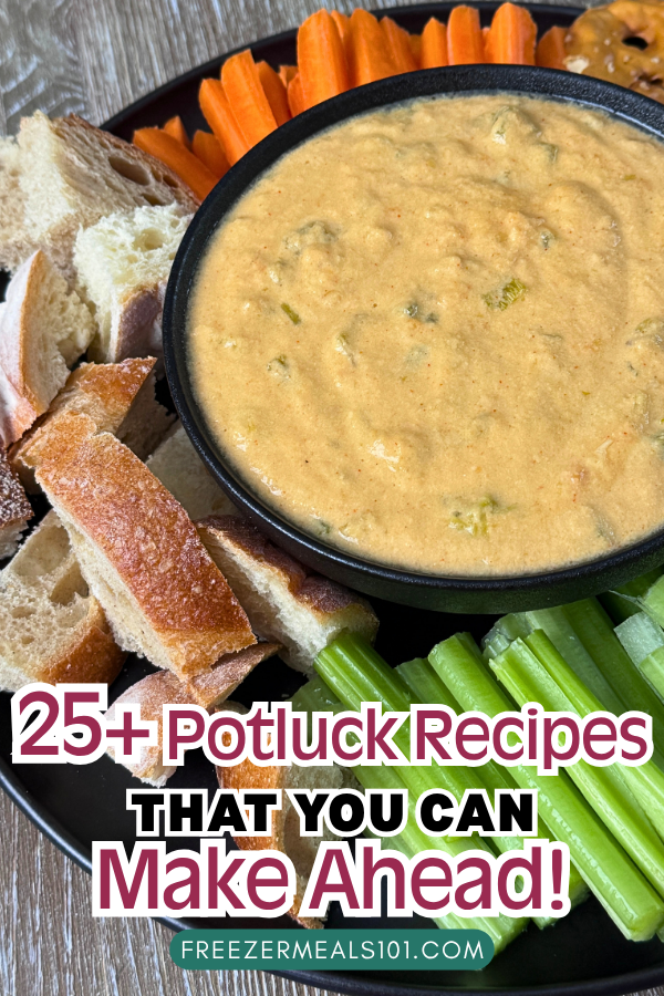orange melted cheese dip in a bowl next to bread cubes, pretzel chips, raw carrots, and raw celery