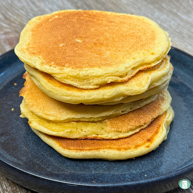 Cottage cheese pancakes stacked on a plate