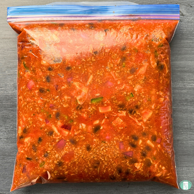 Make ahead low carb chili in a ziploc bag ready to go into the freezer with beans, tomatoes, jalapeno, onion, bacon, ground beef, and seasonings in a red sauce