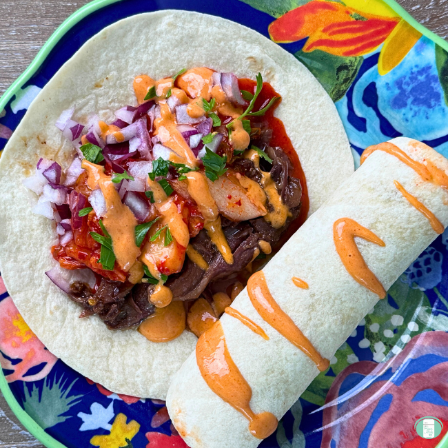 Slow cooked beef, kimchi, red onion, served on a tortilla and drizzled with sriracha mayo