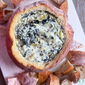Freezer meal spinach artichoke drip served in a bread bowl