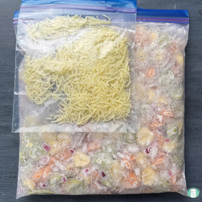 Make ahead creamy mushroom one pot tortellini in a ziploc freezer bag with a smaller ziploc freezer bag of shredded cheese on top