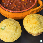 Make ahead jalapeno cornbread muffins served with a bowl of chili